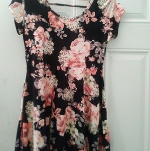 Black dress covered with pink flowers